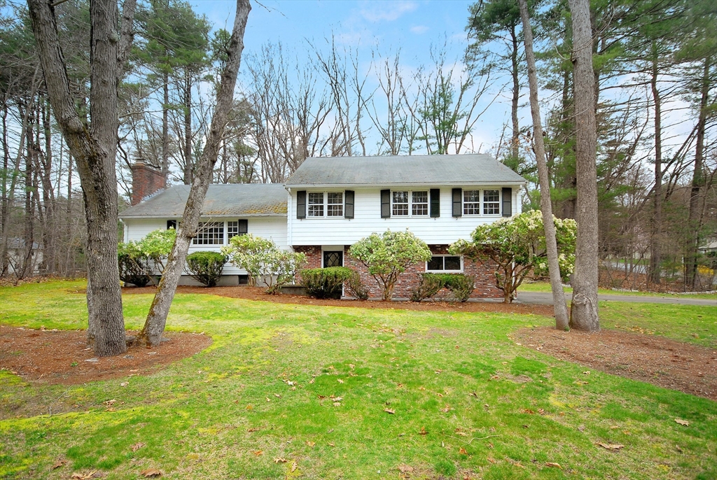 469 Hayward Mill Road Concord, MA 01742 - Photo 1 of 30 a front view of a house with a yard and trees