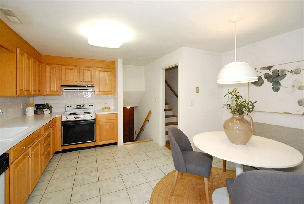 469 Hayward Mill Road Concord, MA 01742 - Photo 11 of 30 a kitchen with a table and chairs