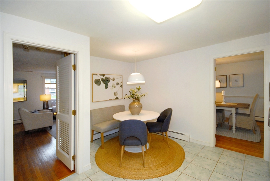 469 Hayward Mill Road Concord, MA 01742 - Photo 12 of 30 a dining room with furniture and wooden floor