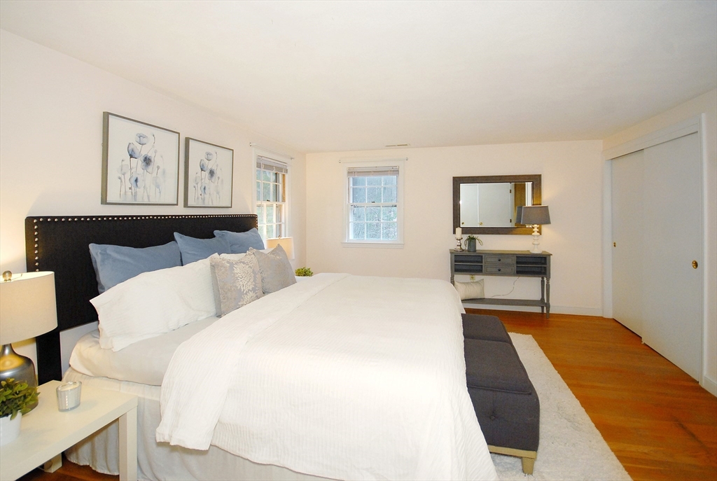 469 Hayward Mill Road Concord, MA 01742 - Photo 15 of 30 a spacious bedroom with a bed and a cabinets
