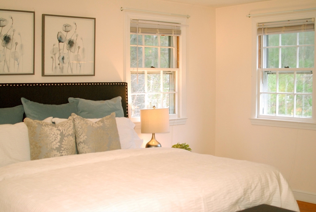 469 Hayward Mill Road Concord, MA 01742 - Photo 16 of 30 a bedroom with a bed and window