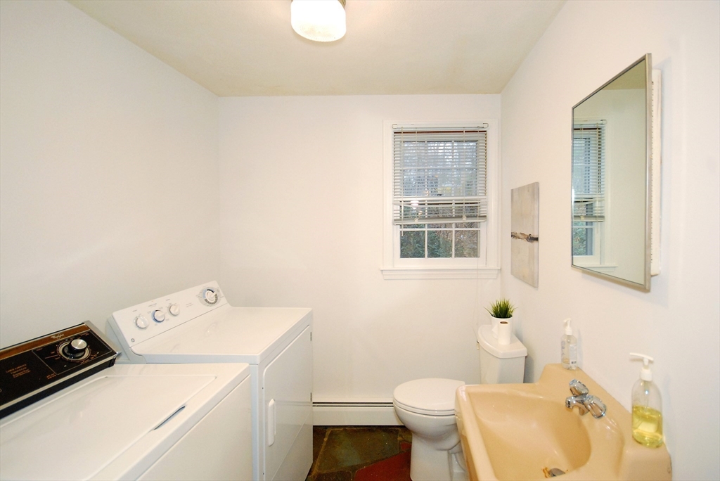 469 Hayward Mill Road Concord, MA 01742 - Photo 27 of 30 a bathroom with a sink a toilet and a window