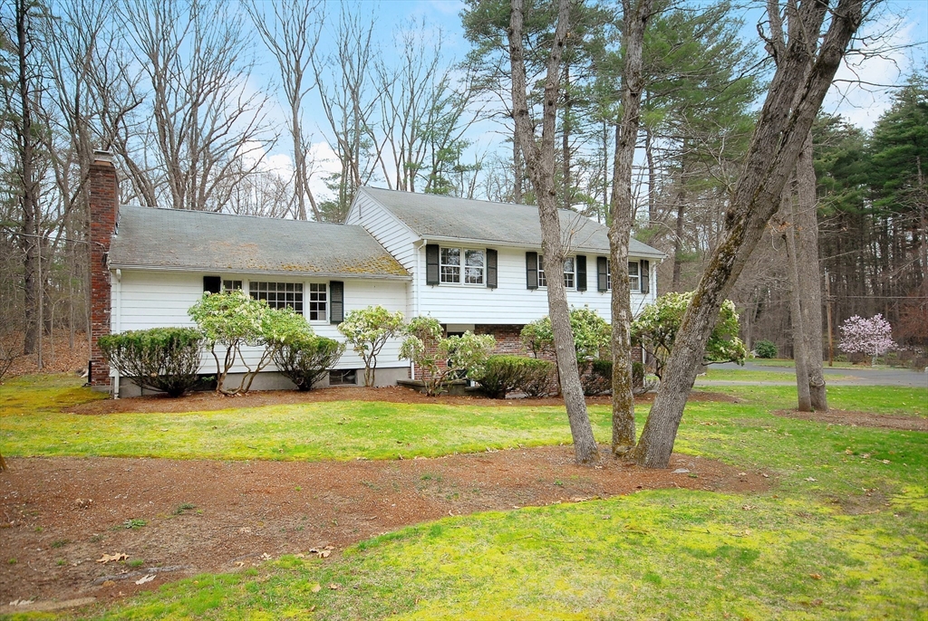469 Hayward Mill Road Concord, MA 01742 - Photo 28 of 30 a front view of a house with a yard and trees
