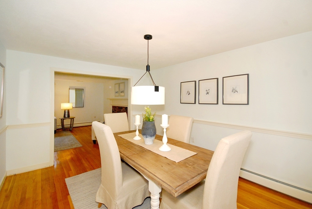 469 Hayward Mill Road Concord, MA 01742 - Photo 6 of 30 a view of a dining room with furniture and wooden floor