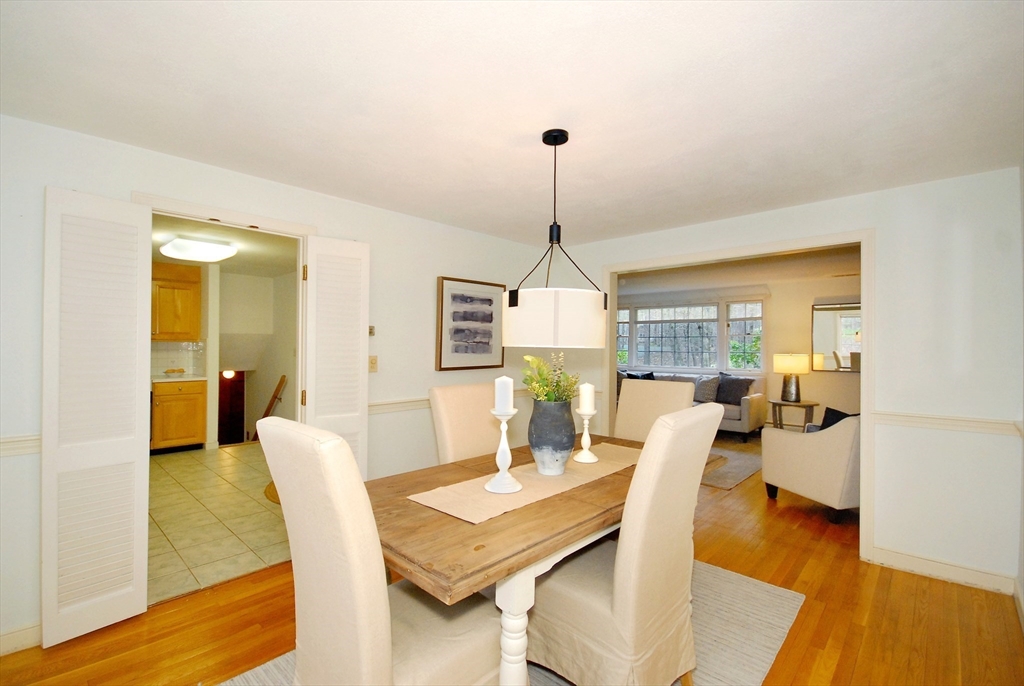469 Hayward Mill Road Concord, MA 01742 - Photo 7 of 30 a view of a dining room with furniture and wooden floor