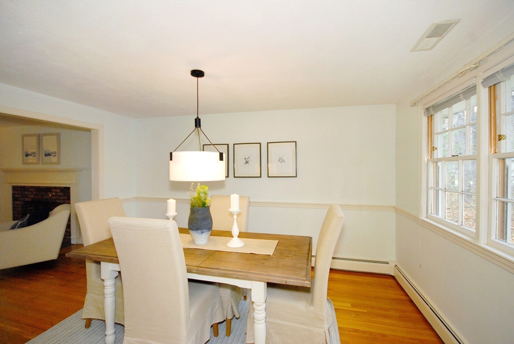 469 Hayward Mill Road Concord, MA 01742 - Photo 8 of 30 a view of a dining room with furniture window and wooden floor