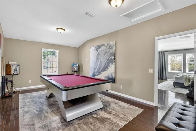 a room with furniture and wooden floor