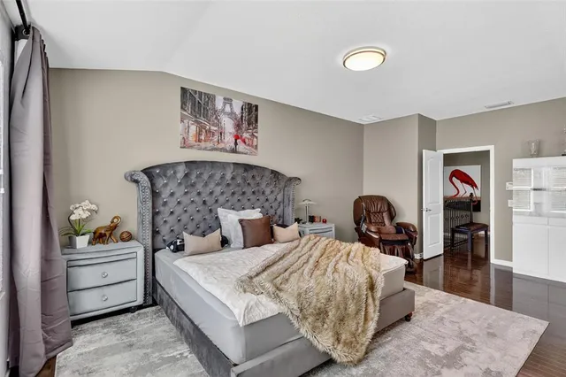 a bed room with bed and night stand