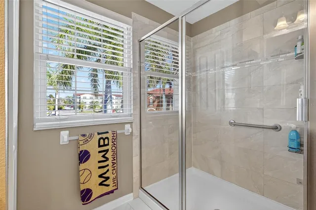 a bathroom with a bathtub and shower