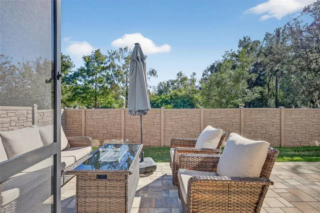 a view of an outdoor sitting area with furniture