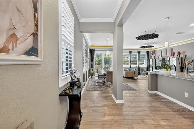 a lobby with furniture and floor to ceiling window