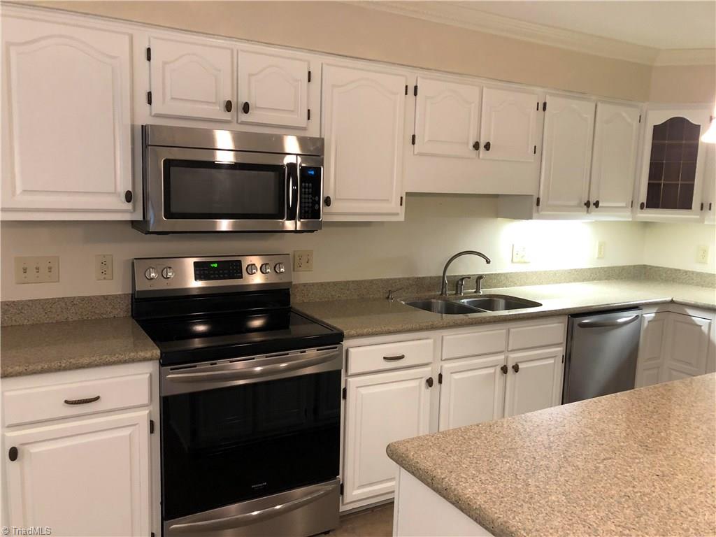 1301 Georgetown Court High Point, NC 27262 - Photo 8 of 29 Updated kitchen with freshly painted cabinets, new granite countertops, and new stainless steel appliances