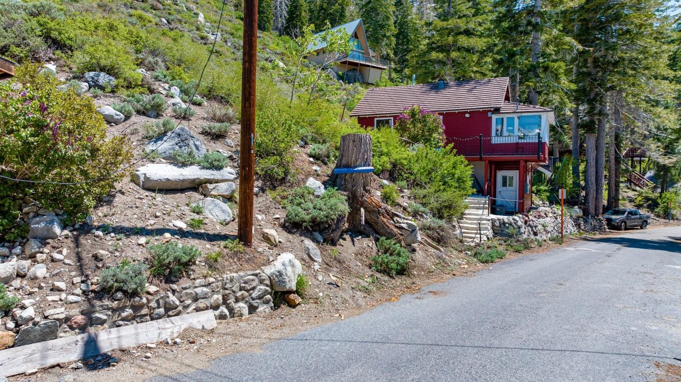 a front view of a house with garden