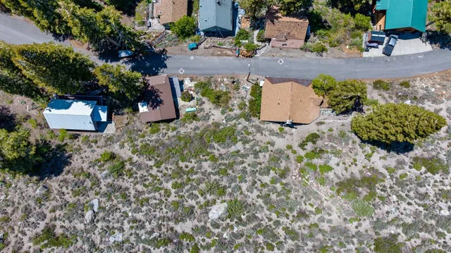 an aerial view of residential house with outdoor space