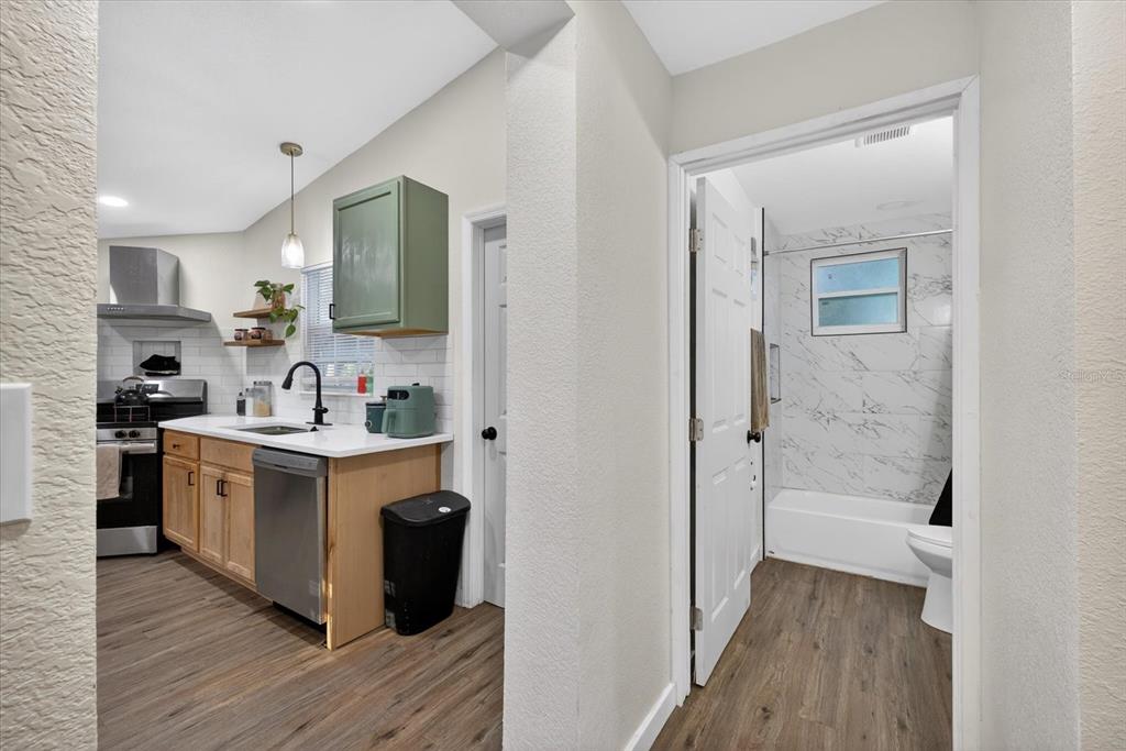 4233 Vinson Road Lakeland, FL 33810 - Photo 17 of 38 a kitchen with stainless steel appliances granite countertop a refrigerator and a sink