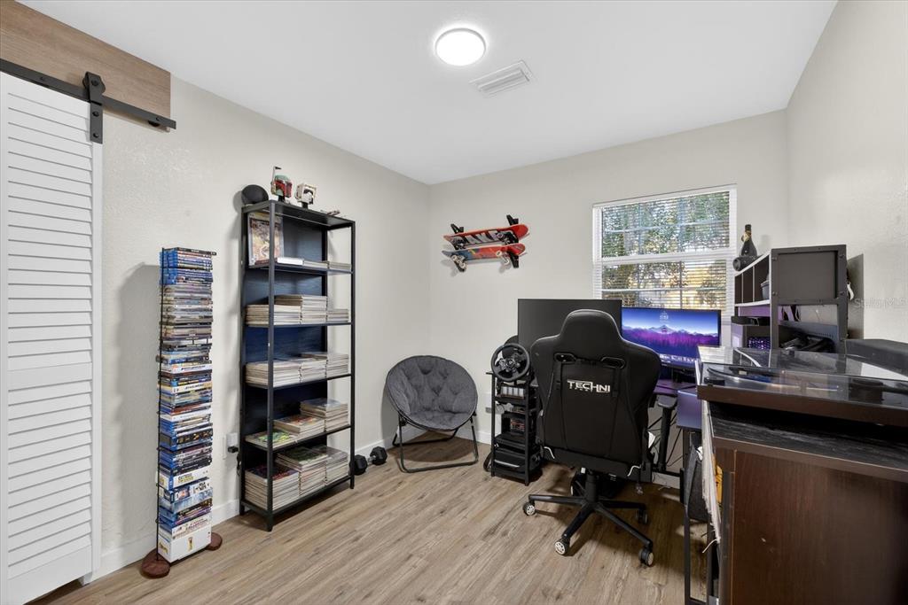 4233 Vinson Road Lakeland, FL 33810 - Photo 18 of 38 a view of a workspace with furniture and a window