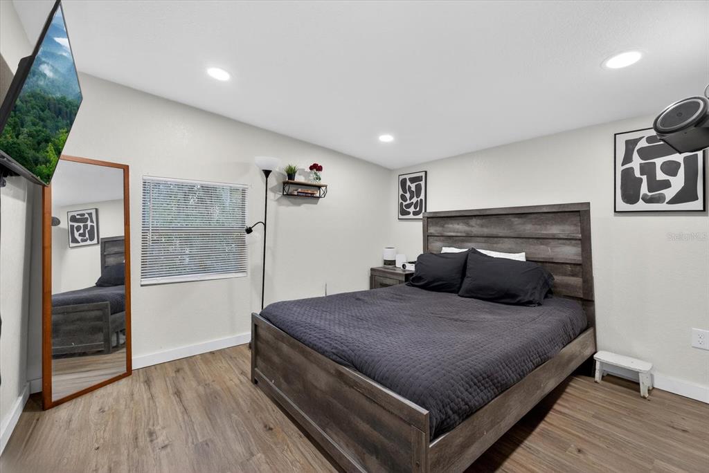 4233 Vinson Road Lakeland, FL 33810 - Photo 23 of 38 a bedroom with a bed and a view of bathroom