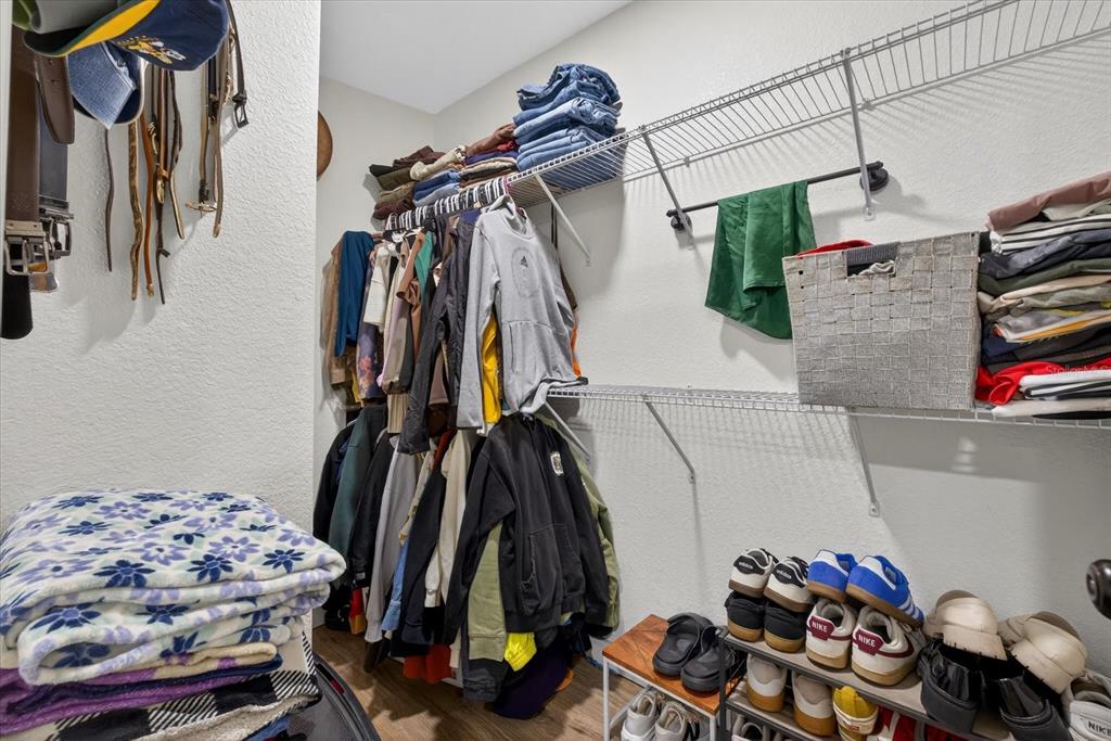 4233 Vinson Road Lakeland, FL 33810 - Photo 26 of 38 a view of walk in closet with clothes and shoes