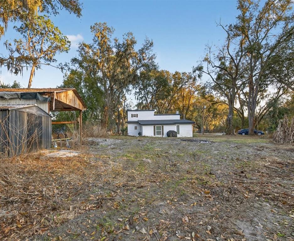 4233 Vinson Road Lakeland, FL 33810 - Photo 36 of 38 a view of a house with a yard
