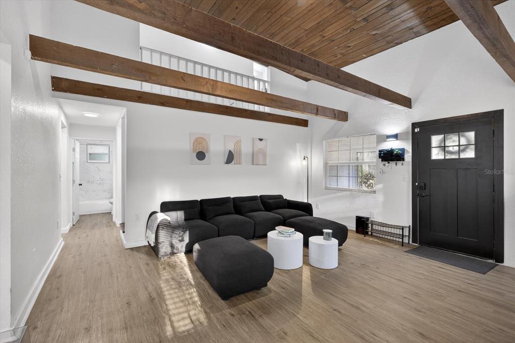 4233 Vinson Road Lakeland, FL 33810 - Photo 7 of 38 a living room with furniture and wooden floor
