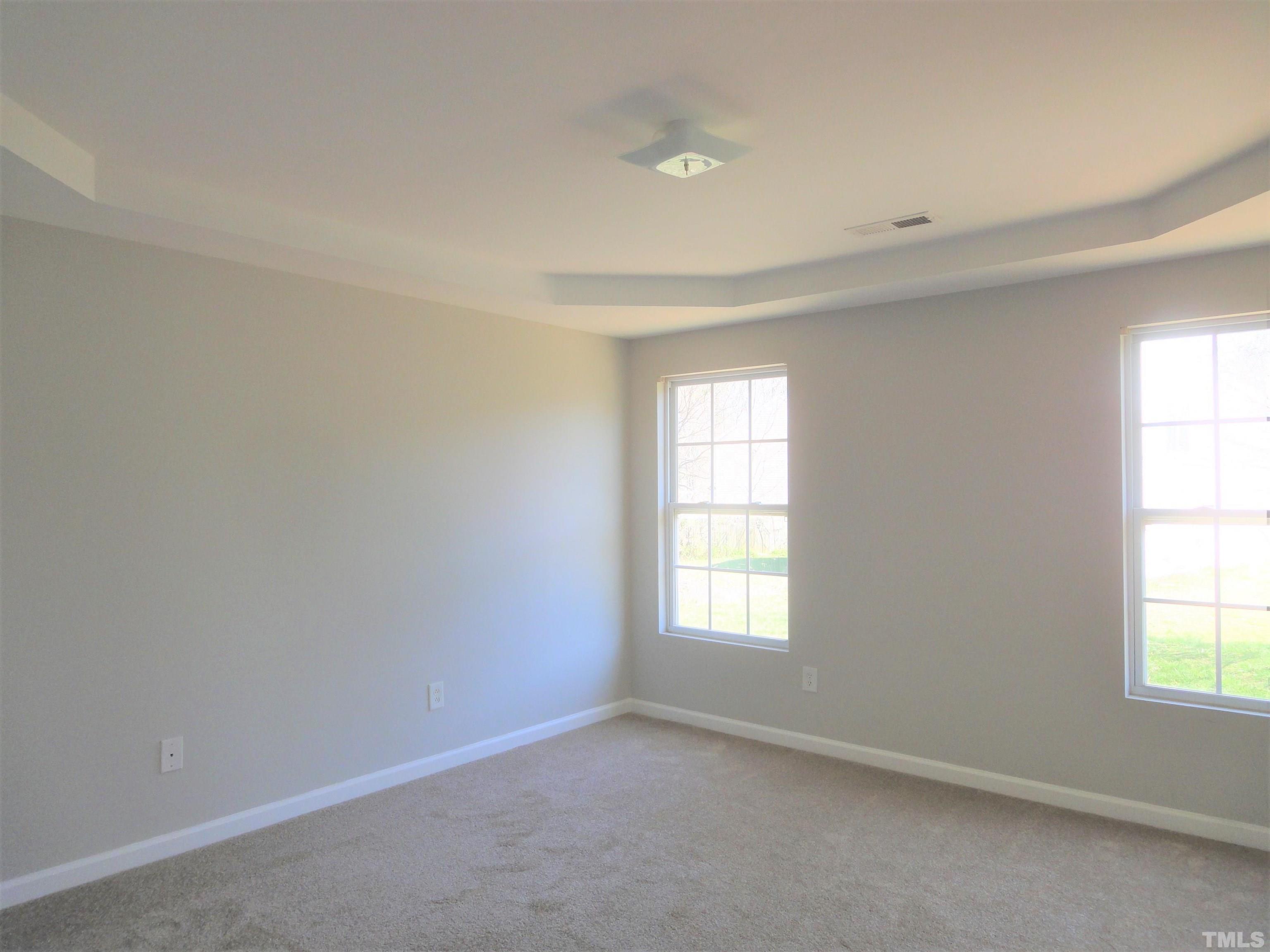 3615 Cyrus Street Raleigh, NC 27610 - Photo 17 of 36 an empty room with windows