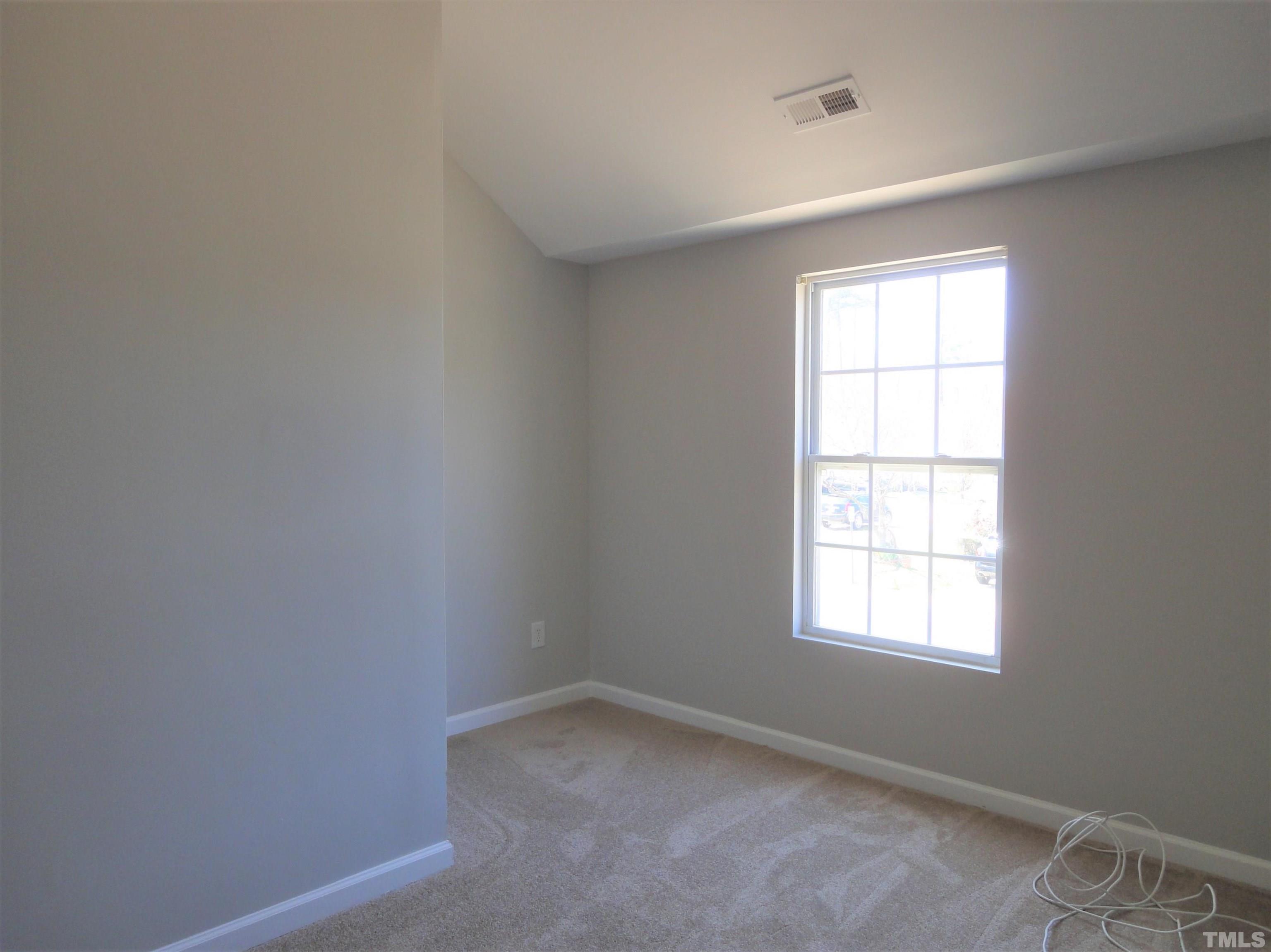 3615 Cyrus Street Raleigh, NC 27610 - Photo 25 of 36 an empty room with a window