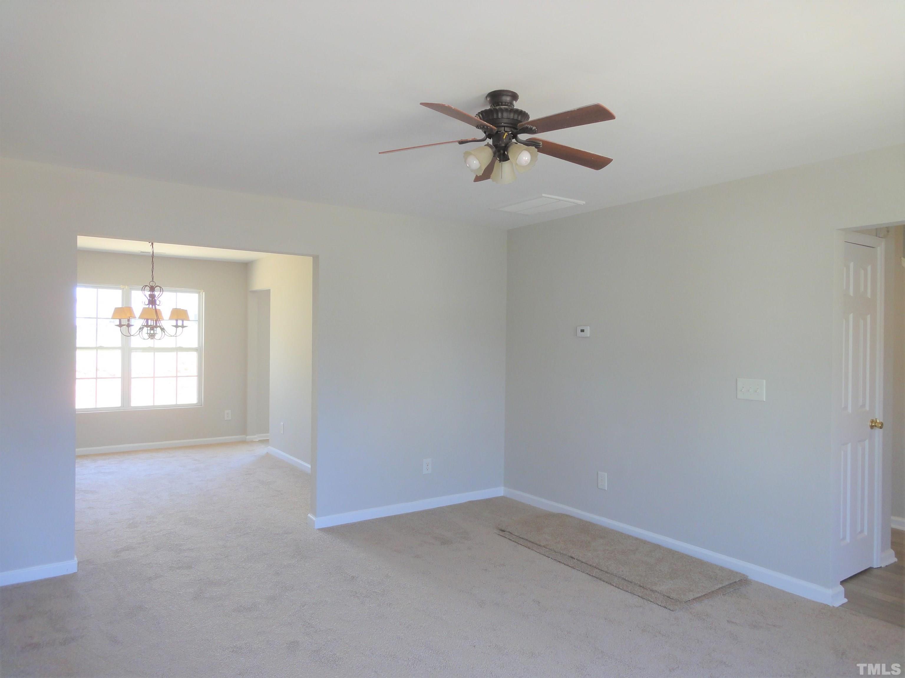 3615 Cyrus Street Raleigh, NC 27610 - Photo 7 of 36 a view of empty room with window
