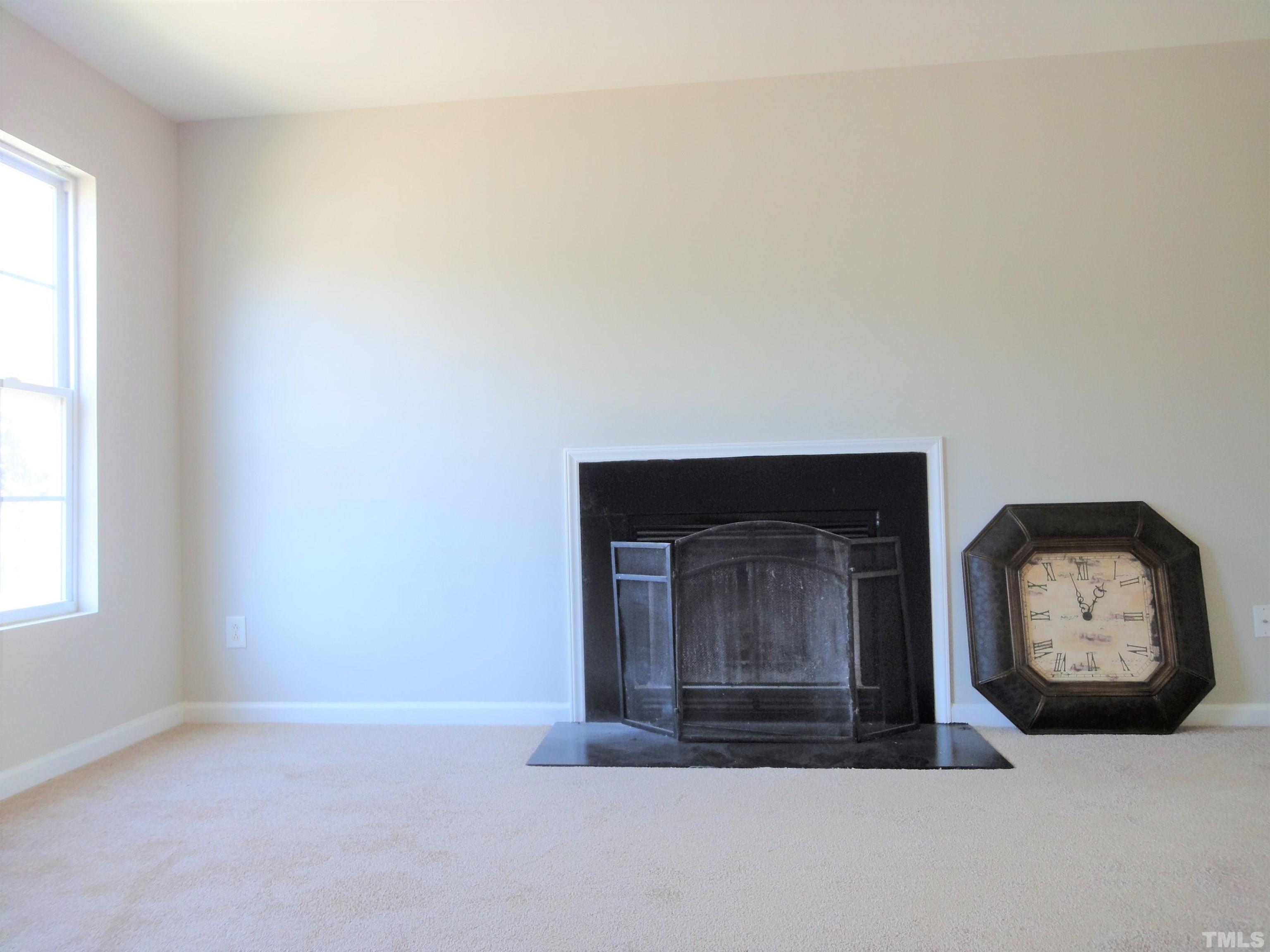 3615 Cyrus Street Raleigh, NC 27610 - Photo 8 of 36 a room with a bed and a window