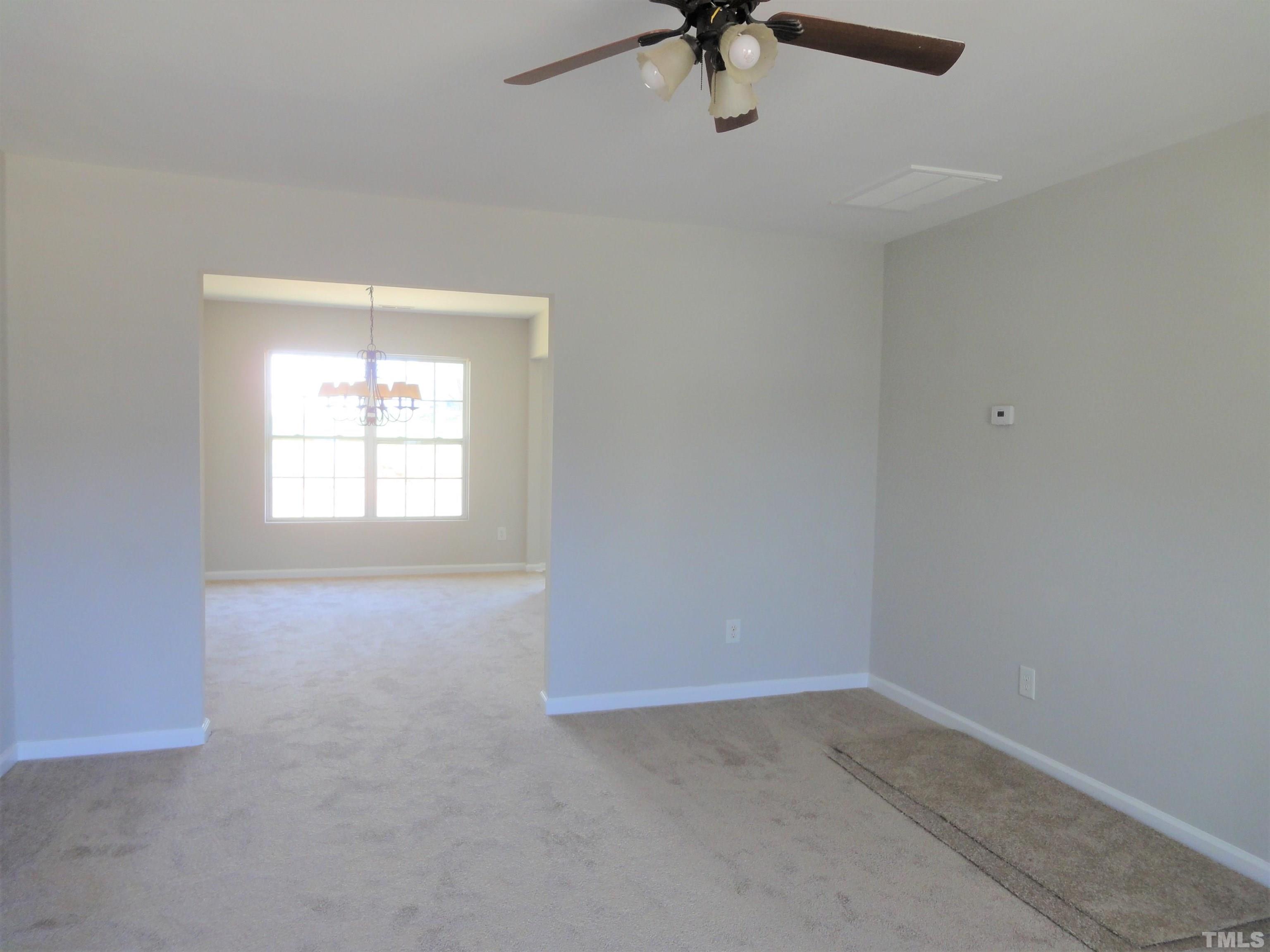3615 Cyrus Street Raleigh, NC 27610 - Photo 9 of 36 an empty room with a window