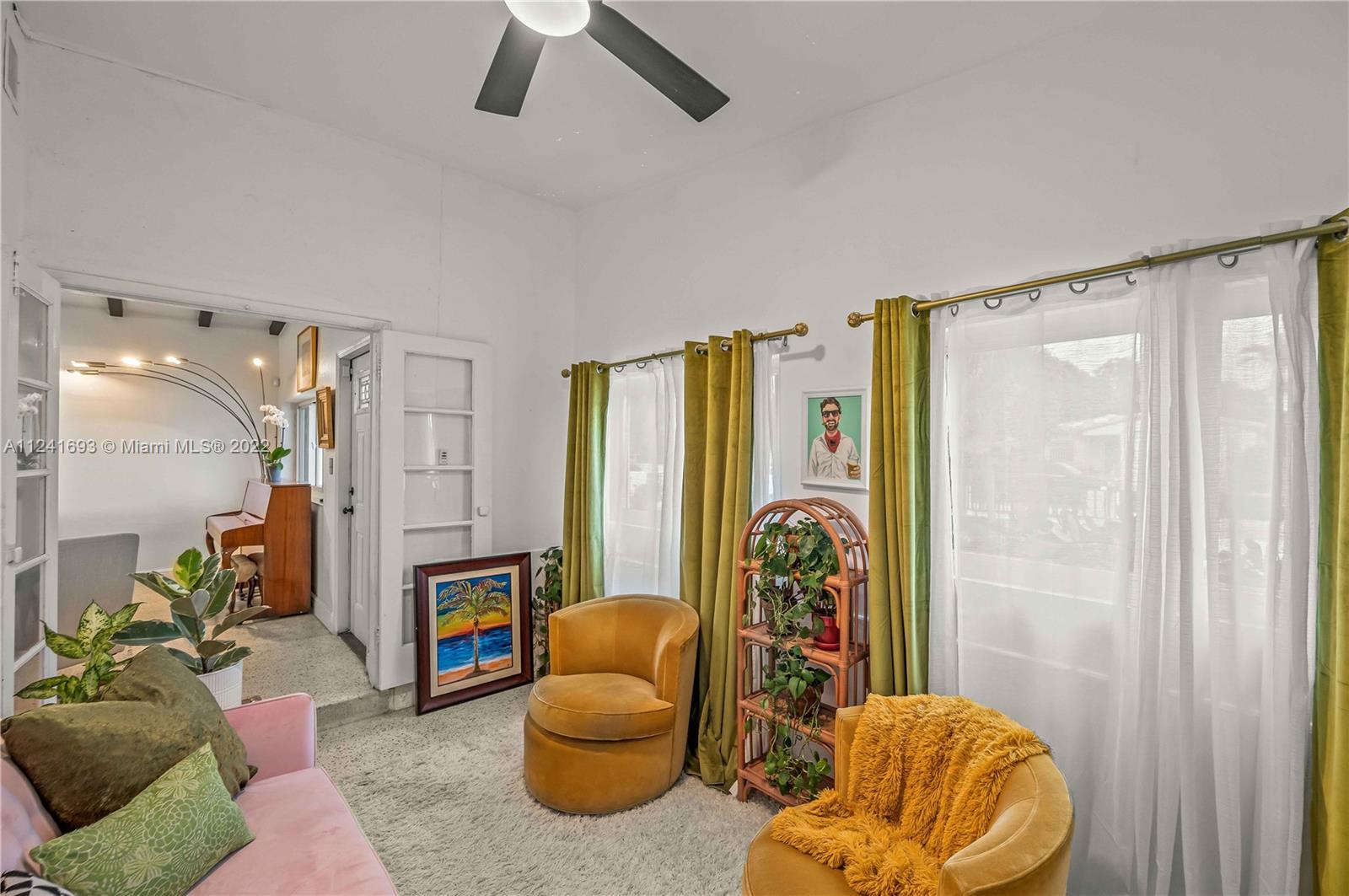 6730 Southwest 32nd Street Miami, FL 33155 - Photo 11 of 31 a living room with furniture and a large window