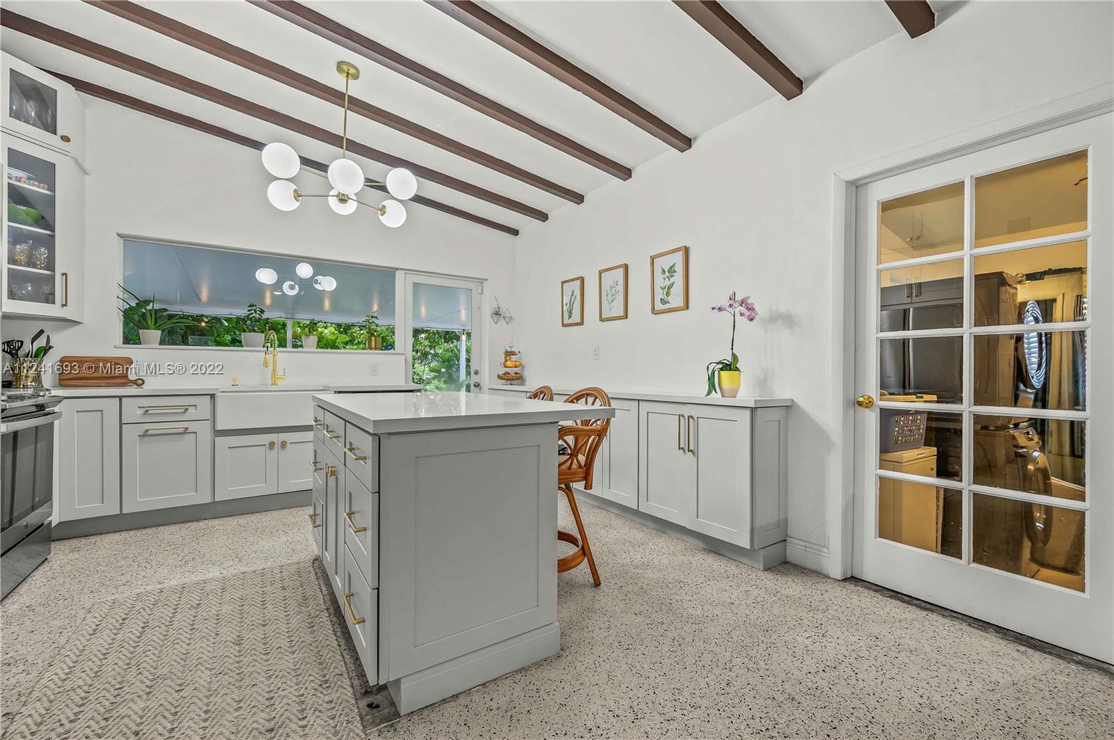 6730 Southwest 32nd Street Miami, FL 33155 - Photo 12 of 31 a kitchen with a sink cabinets and window