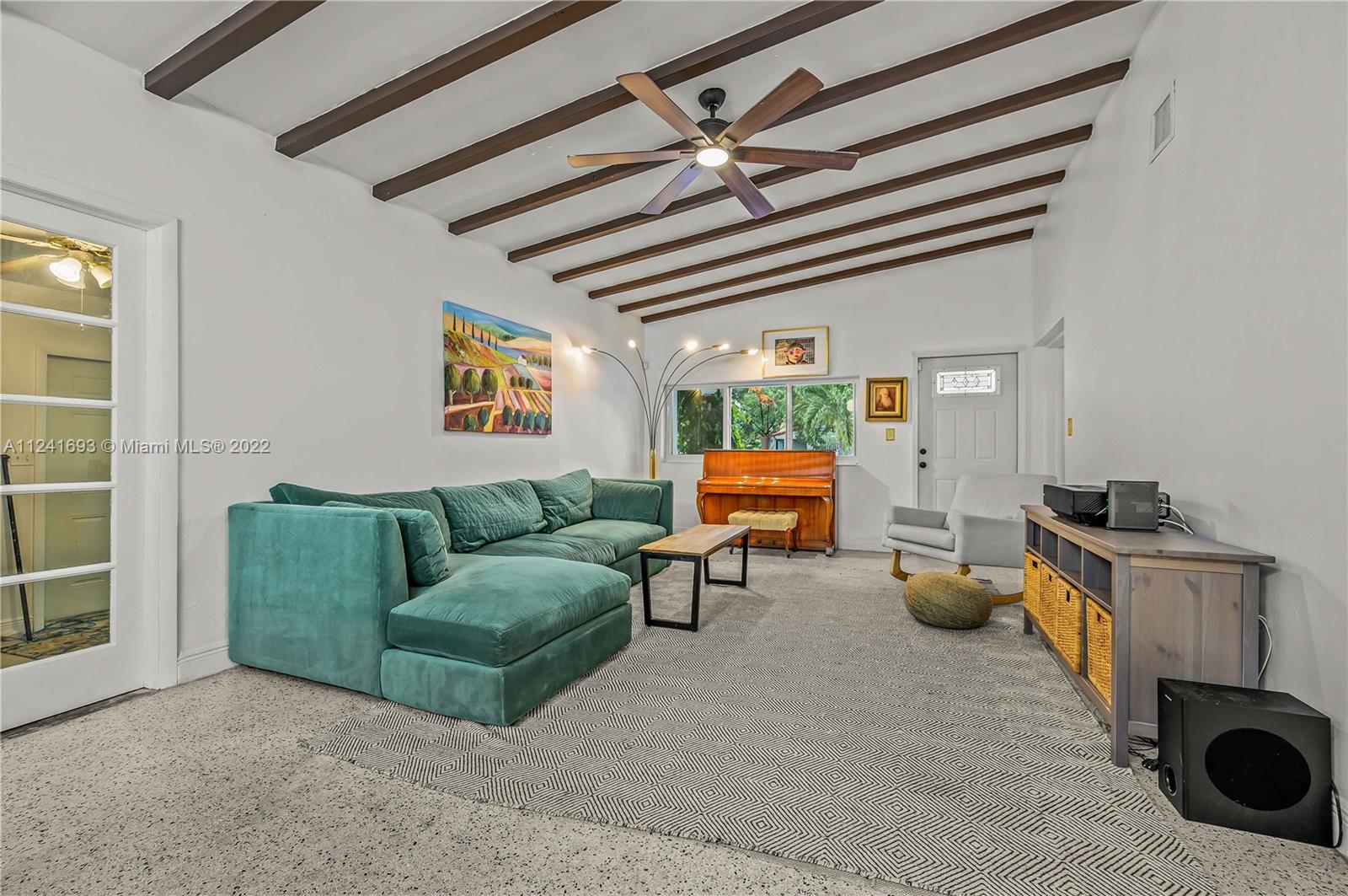 6730 Southwest 32nd Street Miami, FL 33155 - Photo 15 of 31 a living room with furniture and a chandelier