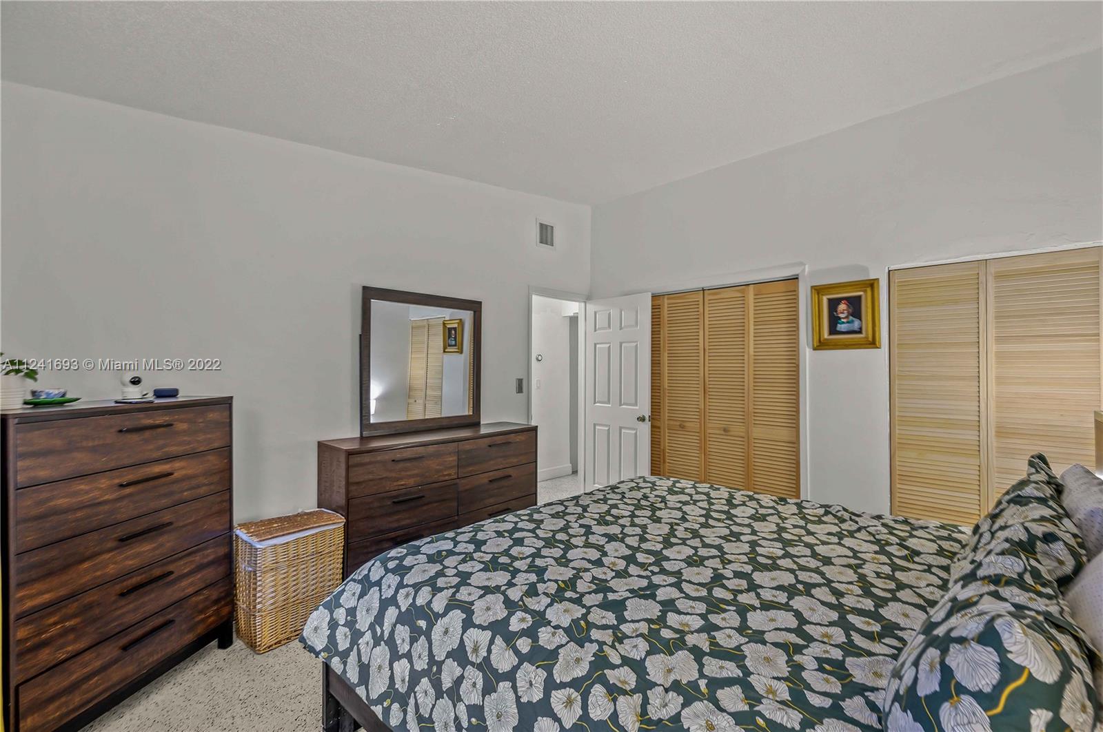 6730 Southwest 32nd Street Miami, FL 33155 - Photo 17 of 31 a bedroom with a bed and a dresser