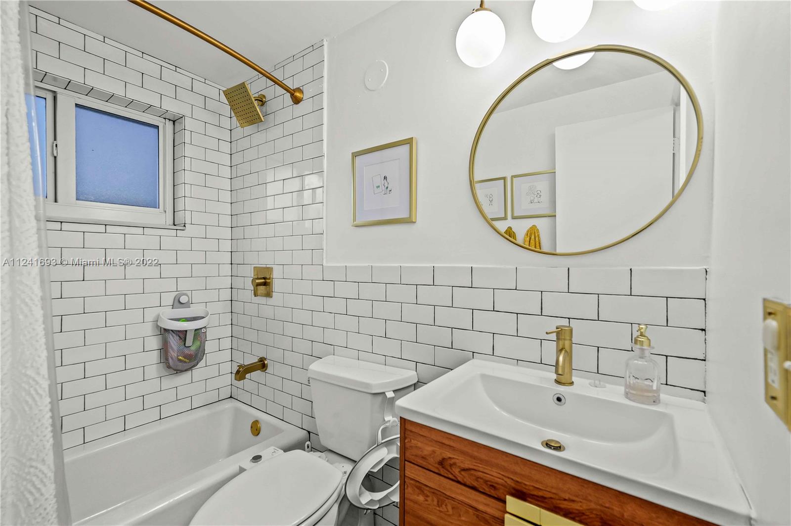 6730 Southwest 32nd Street Miami, FL 33155 - Photo 18 of 31 a bathroom with a sink a toilet and a mirror