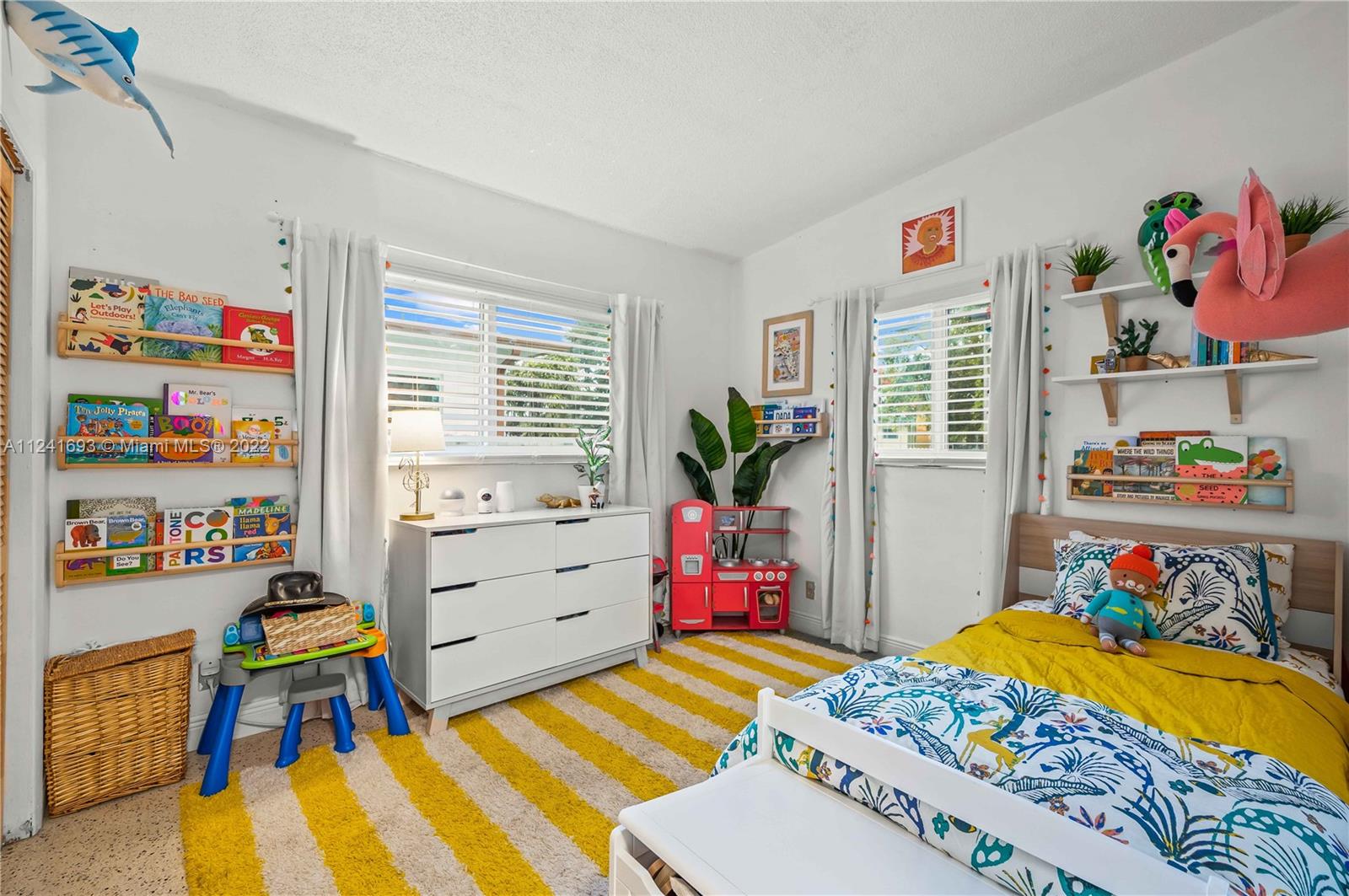 6730 Southwest 32nd Street Miami, FL 33155 - Photo 19 of 31 a bed room with a bed and a desk