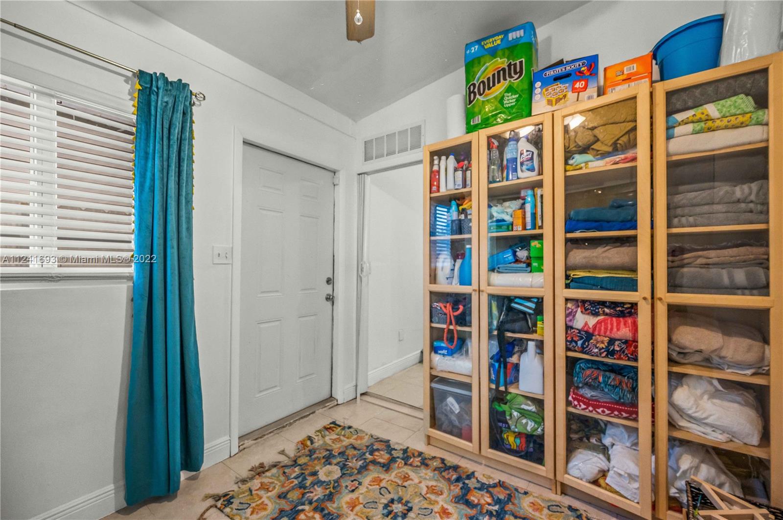 6730 Southwest 32nd Street Miami, FL 33155 - Photo 22 of 31 a book shelf with books on it