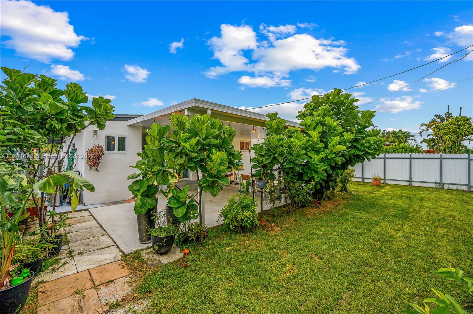 6730 Southwest 32nd Street Miami, FL 33155 - Photo 25 of 31 a view of a house with a big yard