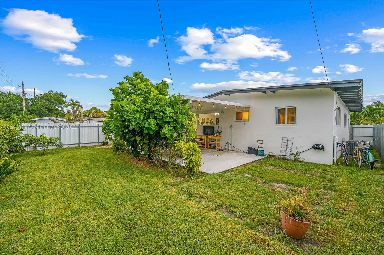 6730 Southwest 32nd Street Miami, FL 33155 - Photo 26 of 31 a view of a backyard with plants and a patio