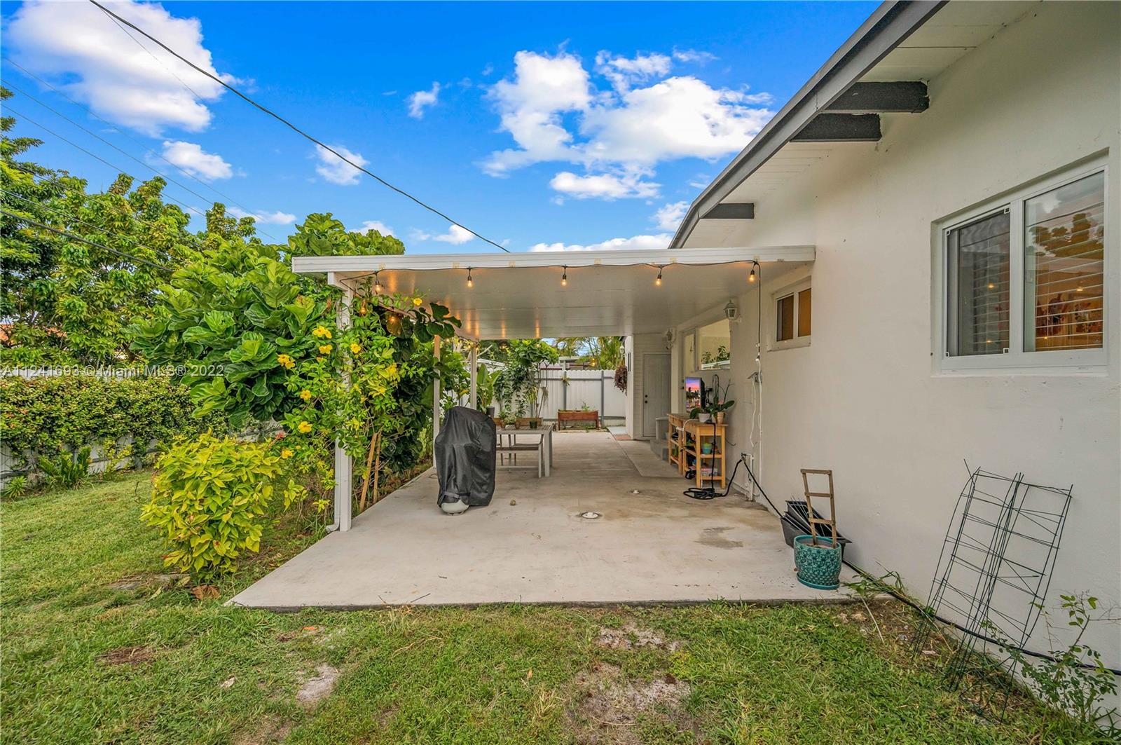 6730 Southwest 32nd Street Miami, FL 33155 - Photo 27 of 31 a view of a backyard with plants and a patio