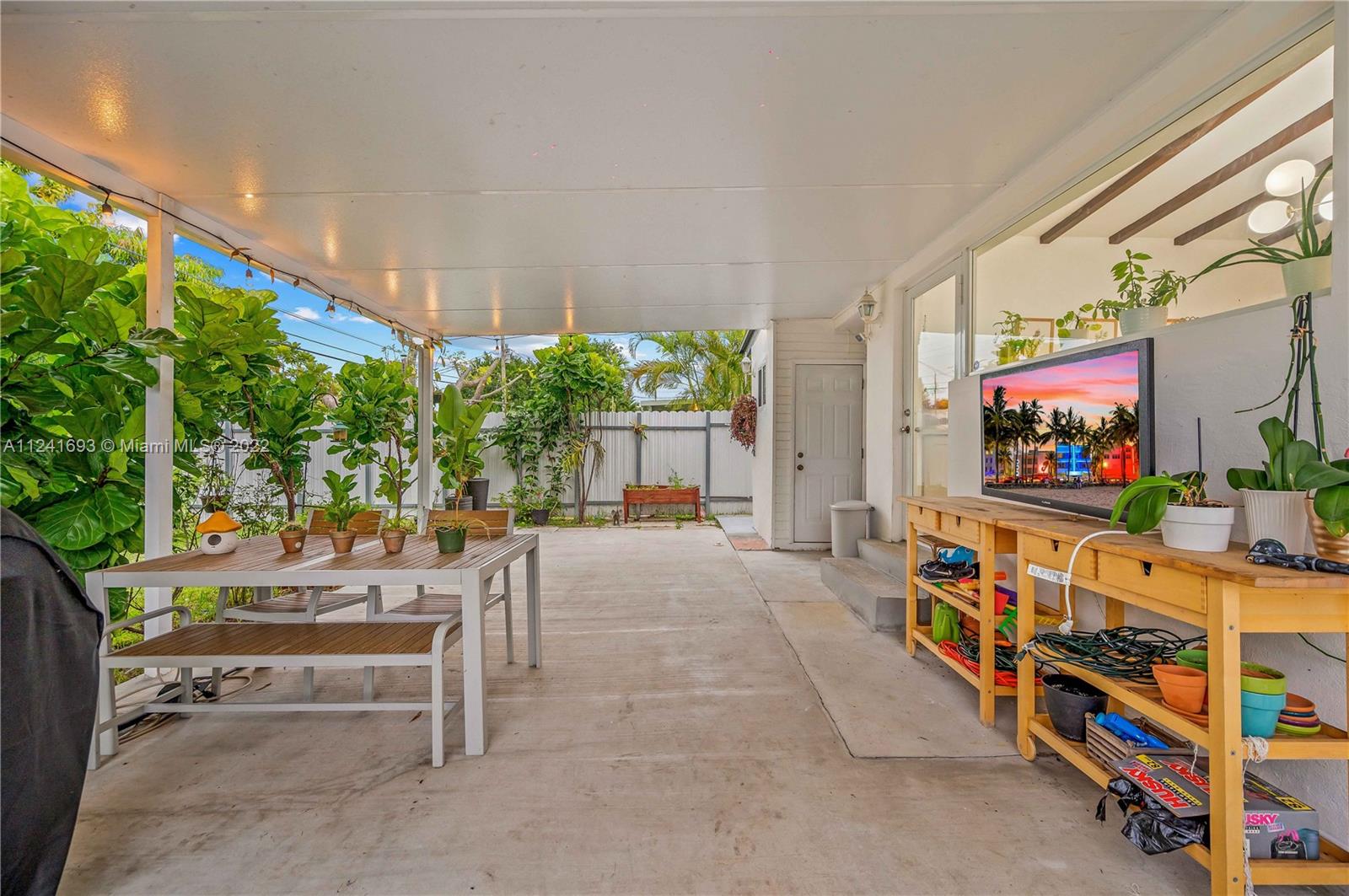 6730 Southwest 32nd Street Miami, FL 33155 - Photo 28 of 31 a outdoor living space with furniture and a flat screen tv