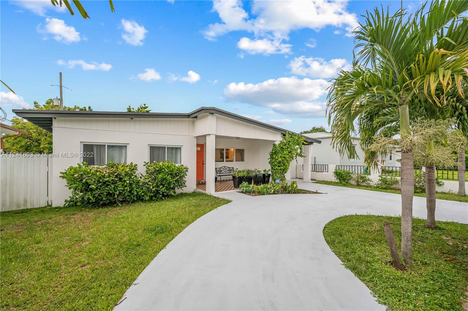 6730 Southwest 32nd Street Miami, FL 33155 - Photo 4 of 31 a front view of a house with a yard