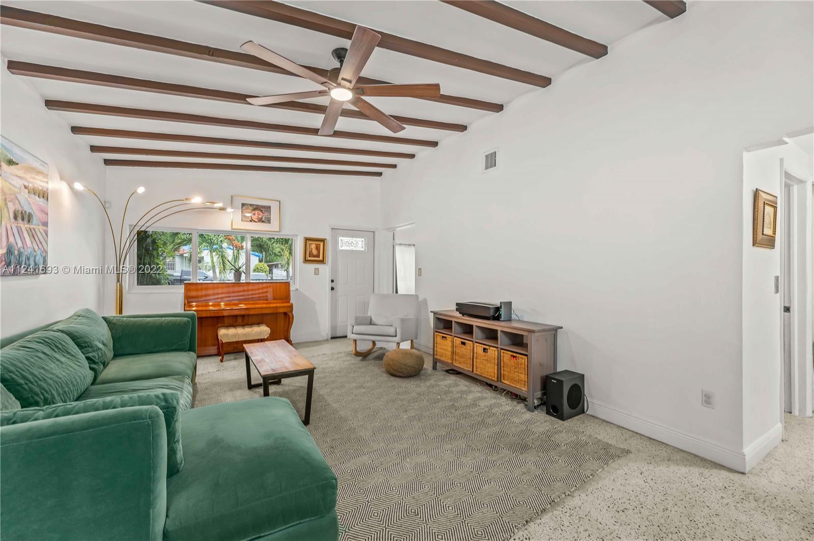 6730 Southwest 32nd Street Miami, FL 33155 - Photo 6 of 31 a living room with furniture and a chandelier