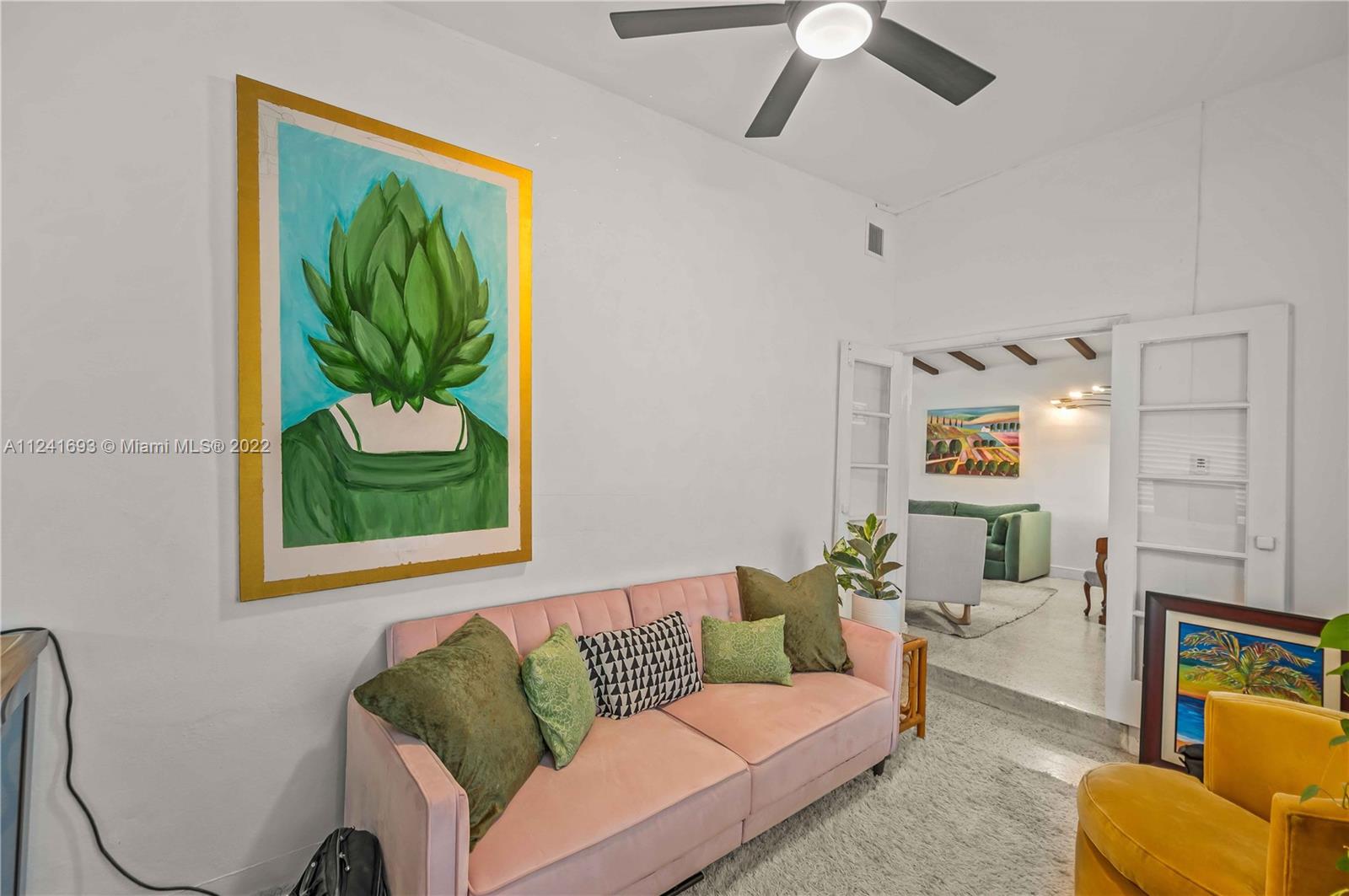 6730 Southwest 32nd Street Miami, FL 33155 - Photo 10 of 31 a living room with furniture and a painting on the wall