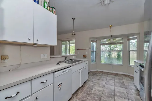 a kitchen with a sink and cabinets