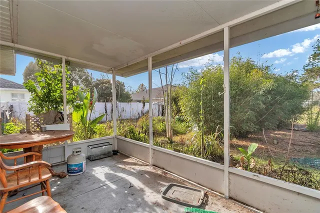 a room with furniture and a large window