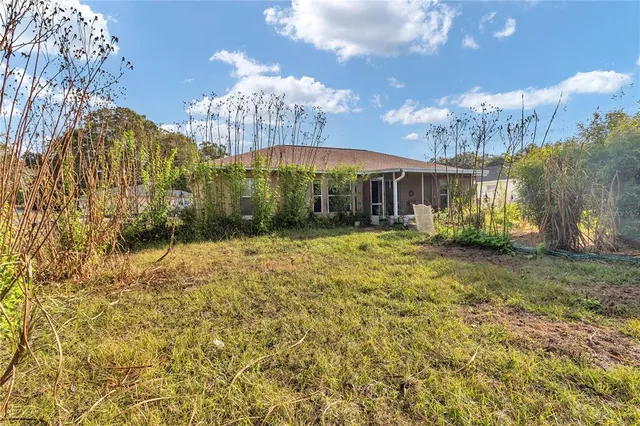 a aerial view of a house with a yard