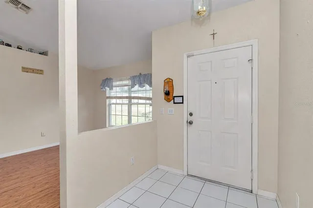 a view of an empty room with an entryway