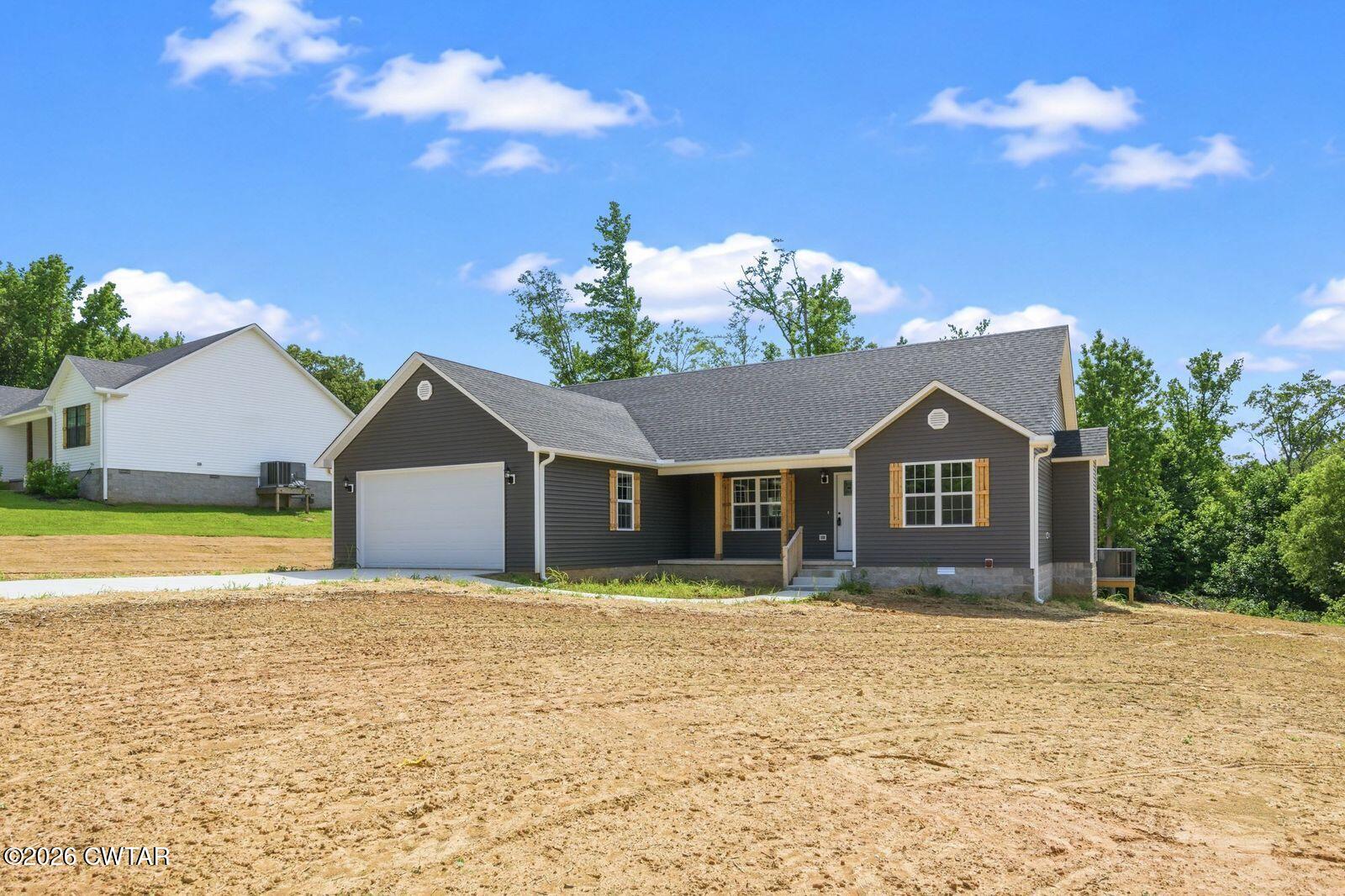 435 Old Huntingdon Road Lexington, TN 38351 - Photo 20 of 26 a front view of a house with a yard