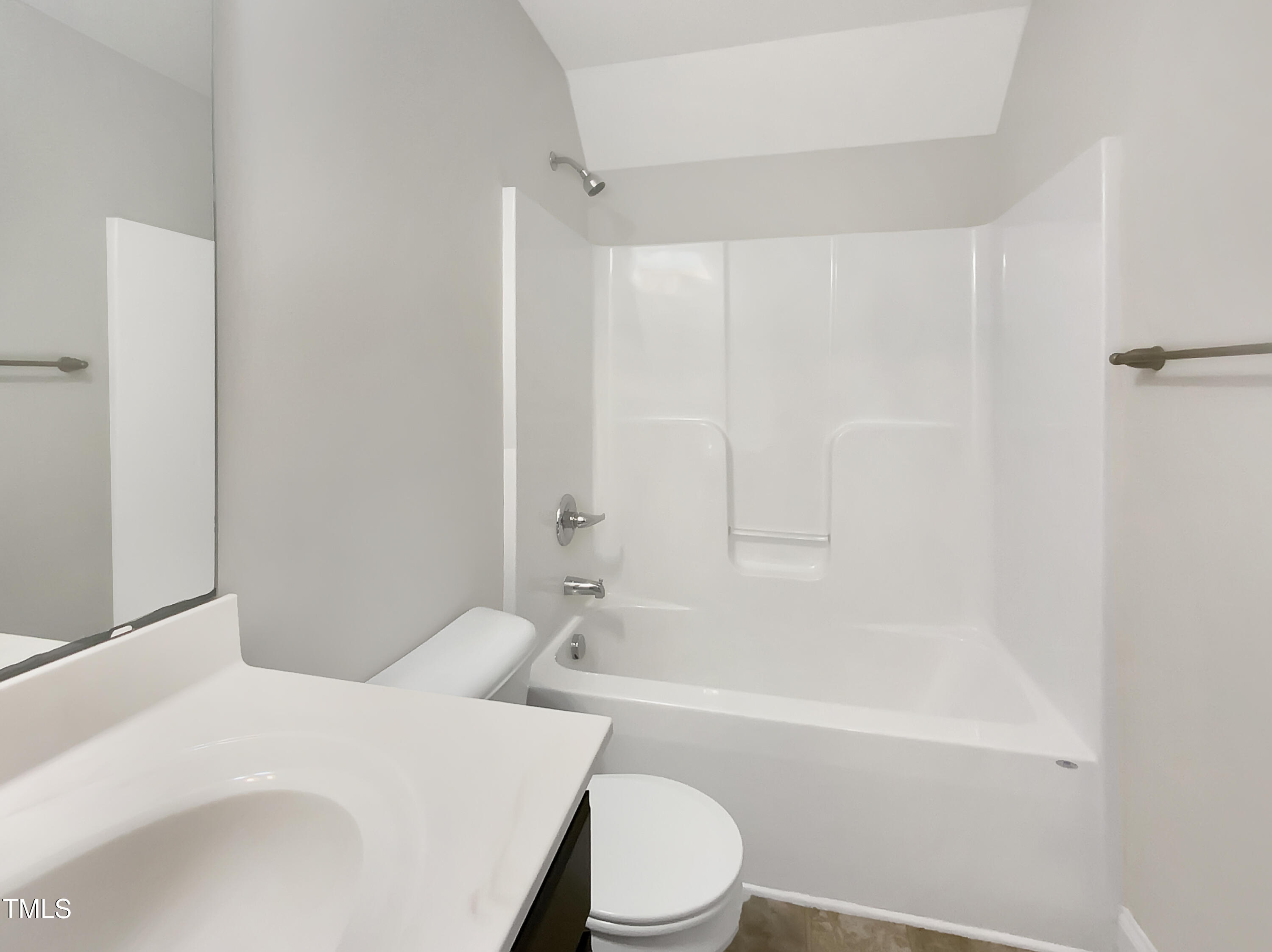 85 Landlocked Circle Angier, NC 27501 - Photo 19 of 21 a bathroom with a toilet a sink and a bathtub