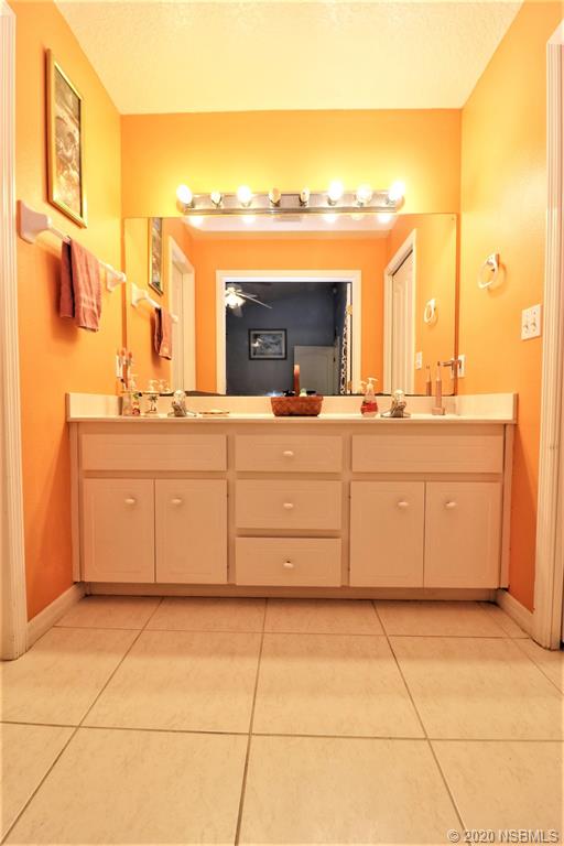 3316 Mango Tree Drive Edgewater, FL 32141 - Photo 14 of 28 a kitchen with stainless steel appliances granite countertop a stove a sink and a refrigerator